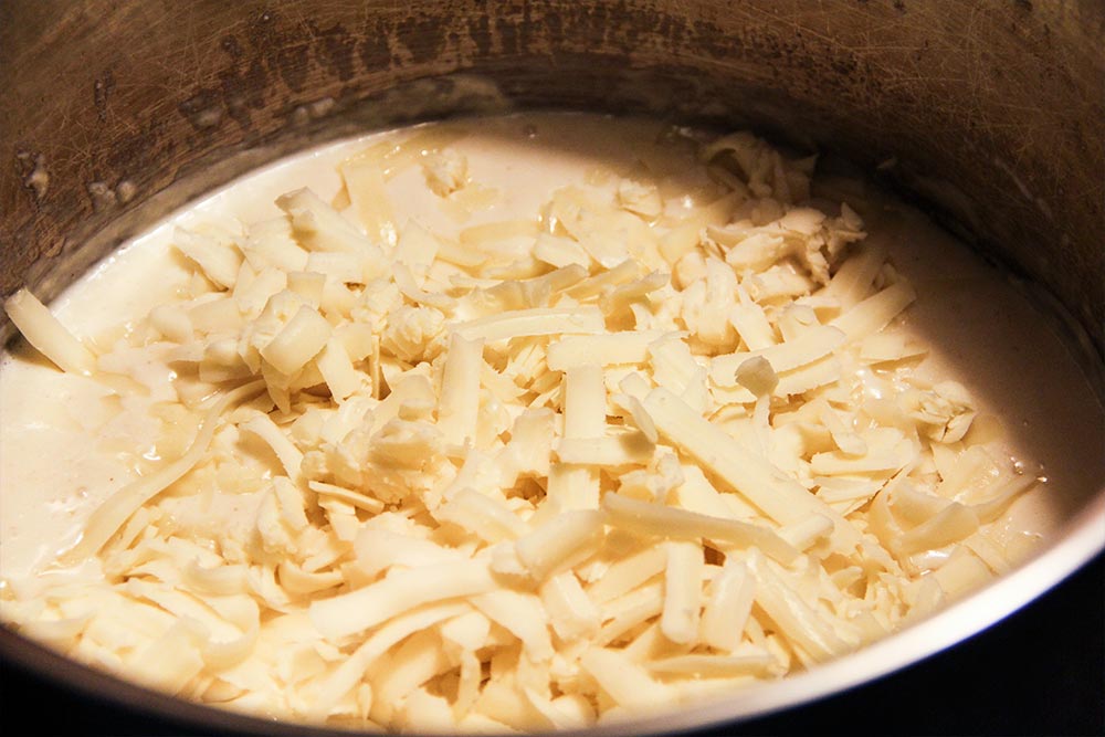 Adding Shredded Cheese to Milk Mixture