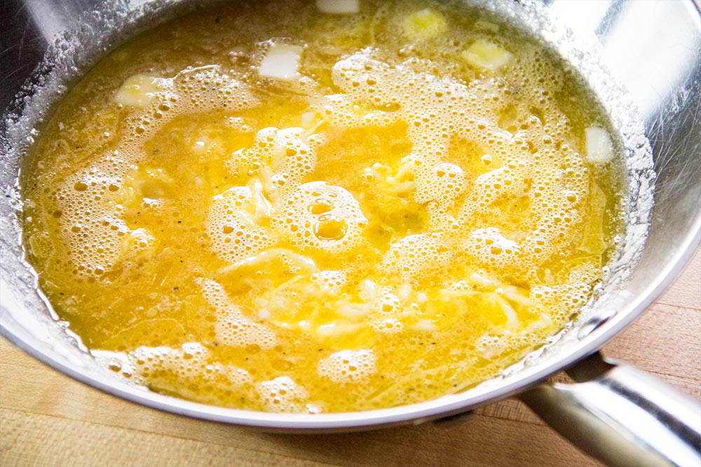 Mixed Eggs in Stainless Steel Skillet