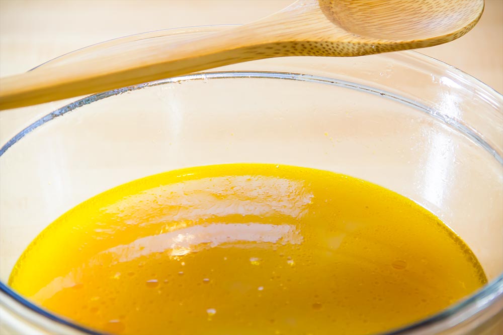 Squash Liquid in Bowl with Wooden Spoon