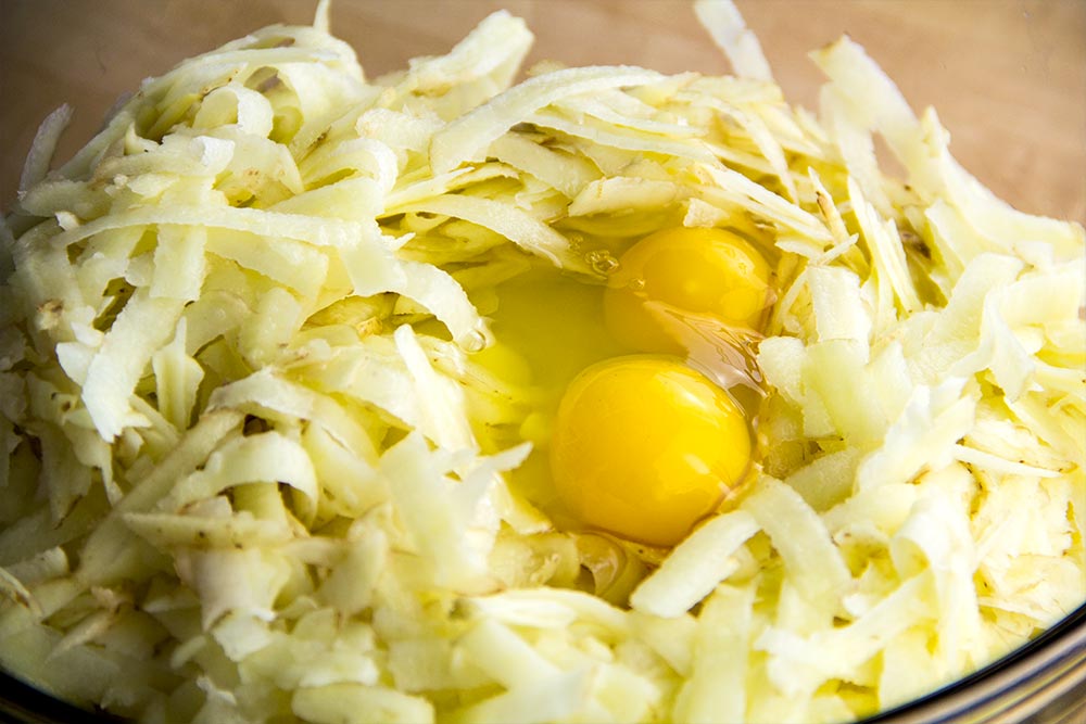 Add Eggs to Shredded Potatoes