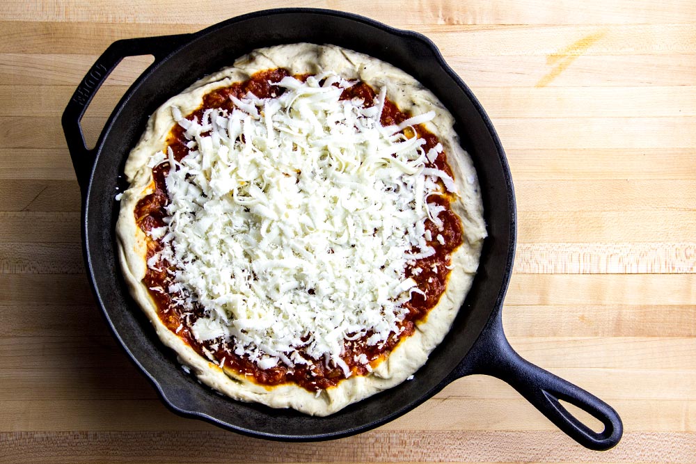 Adding Mozzarella Cheese to Pizza