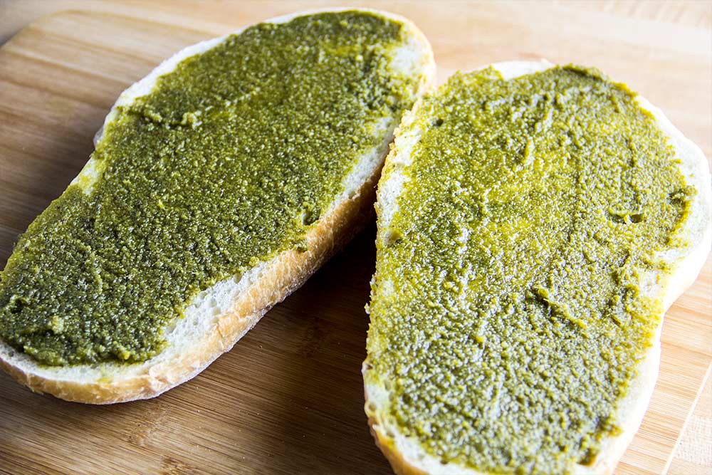 Basil & Garlic Pesto Spread on Loaf of Italian Bread