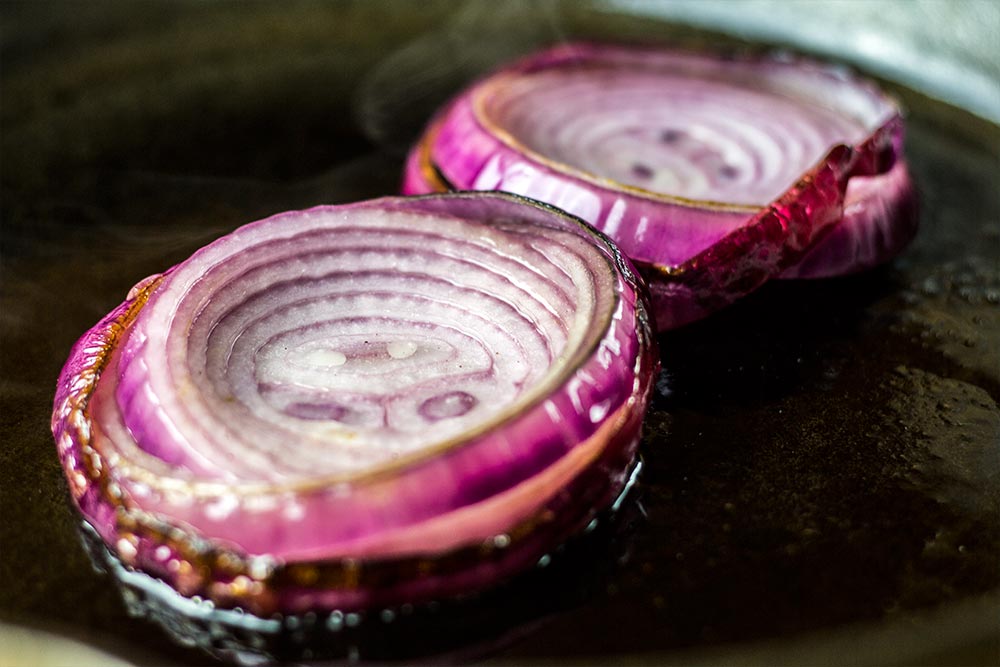 Frying Red Onion Slices in Cast Iron Skillet