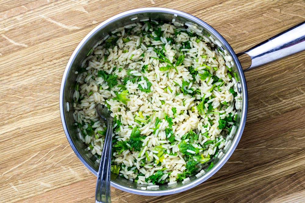 Cooked Rice with Chopped Cilantro in Saucepan