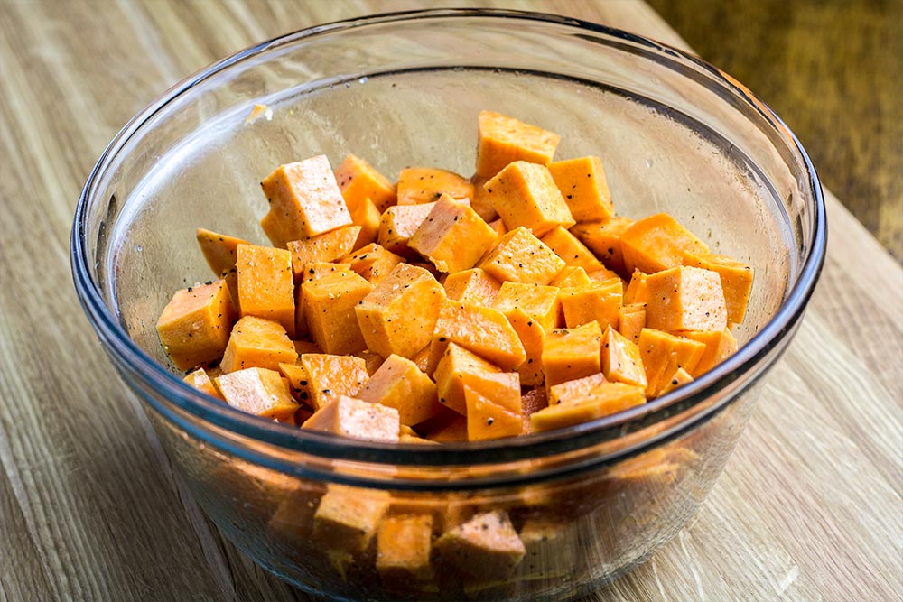 Cubed Sweet Potatoes in Glass Bowl