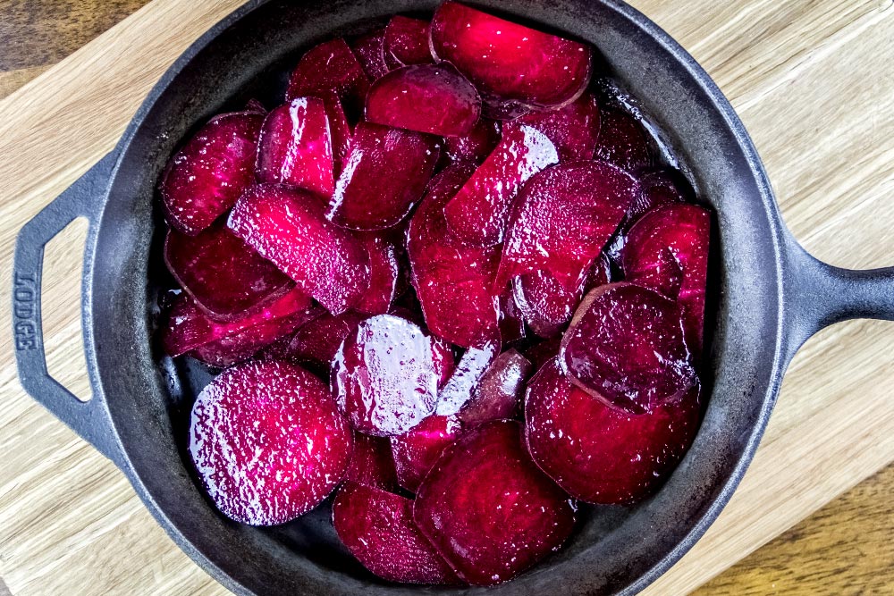 Oil Coated Sliced Beets in Cast Iron Skillet