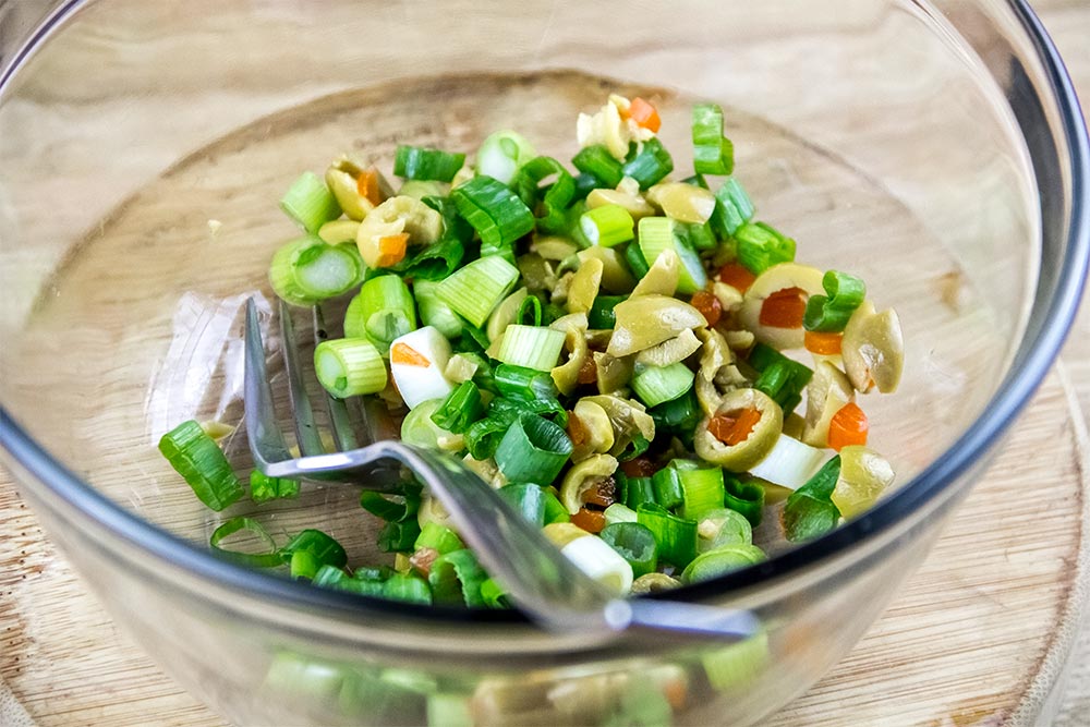 Chopped Scallions and Green Olives in Bowl