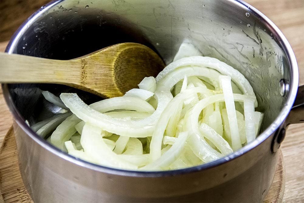 Onion Slices and Extra-Virgin Olive Oil in Medium Saucepan