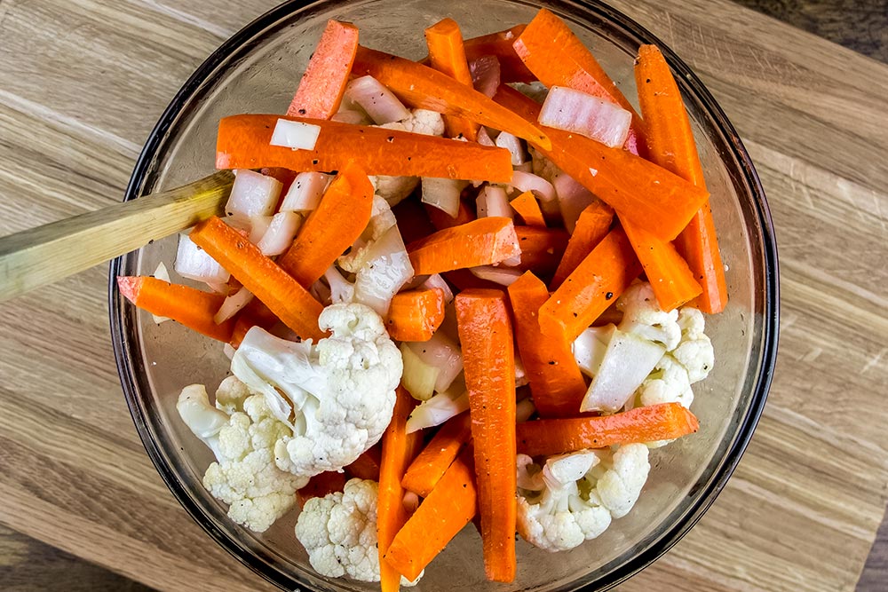 Raw Carrots and Cauliflower in Large Glass Bowl