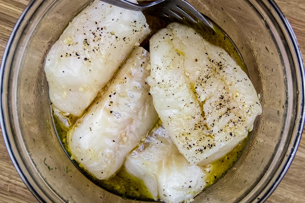 Marinading Pieces of Cod in Bowl