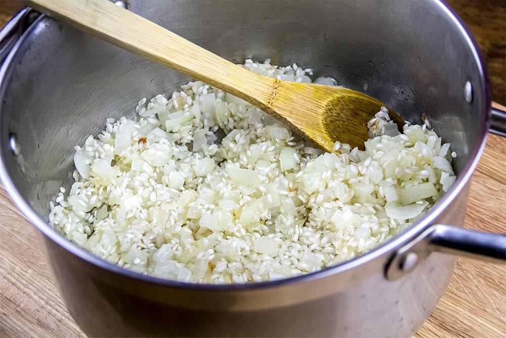 Risotto Rice and Softened Onions in Large Saucepan