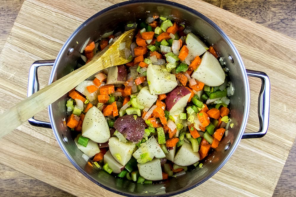 Adding Carrots, Celery and Potatoes to the Pot