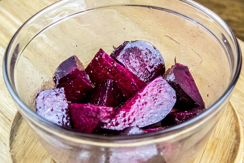 Cut and Oiled Beet Root Pieces in a Bowl