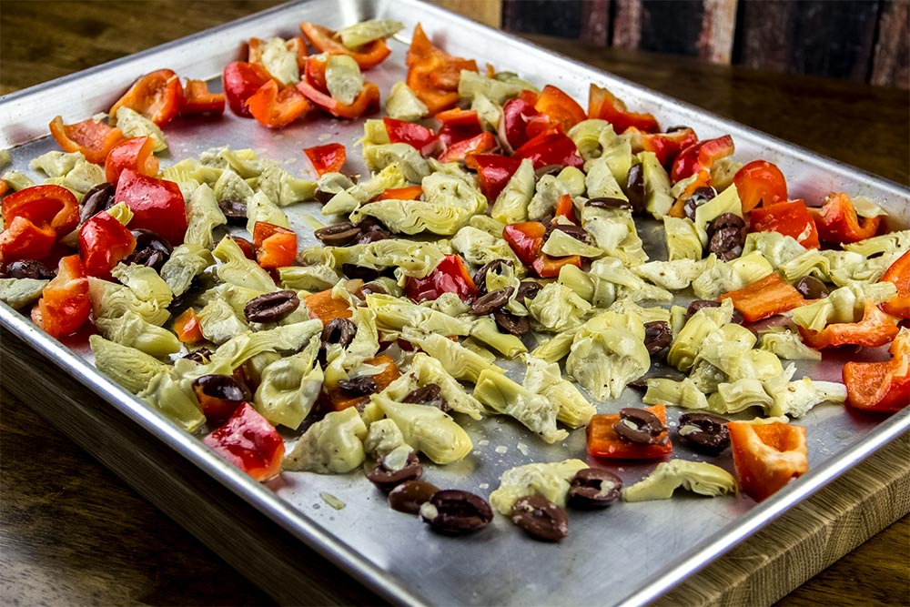 Baking Sheet with Vegetable Mixture On It