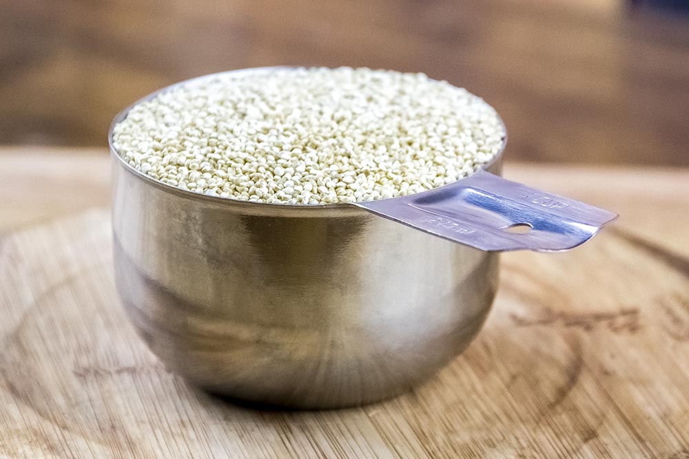 Measuring Cup Filled with Dried Quinoa