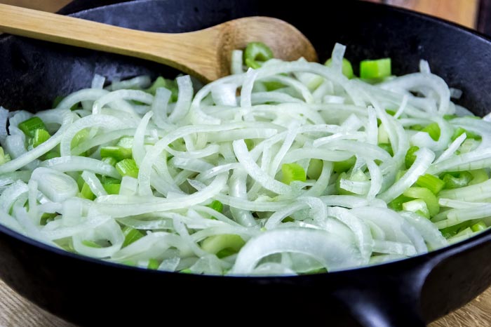 Onion and Celery in Cast Iron Skillet