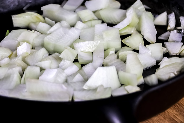 Diced Onion in Cast Iron Skillet