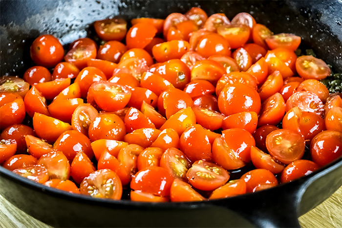 Halved Cherry Tomatoes in Large Cast Iron Skillet