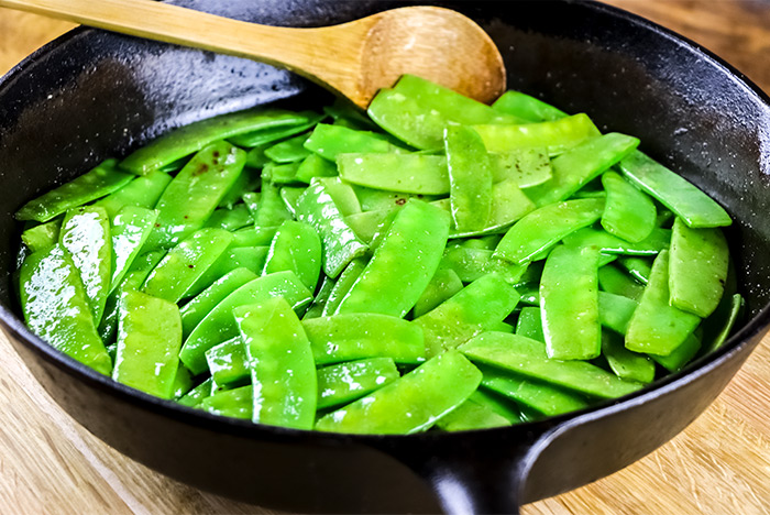 Frying Snow Peas in Cast Iron Skillet