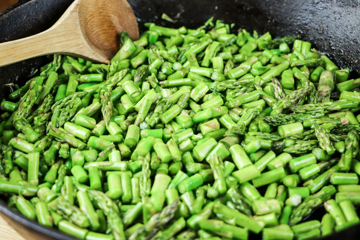 Asparagus Pieces in Cast Iron Skillet
