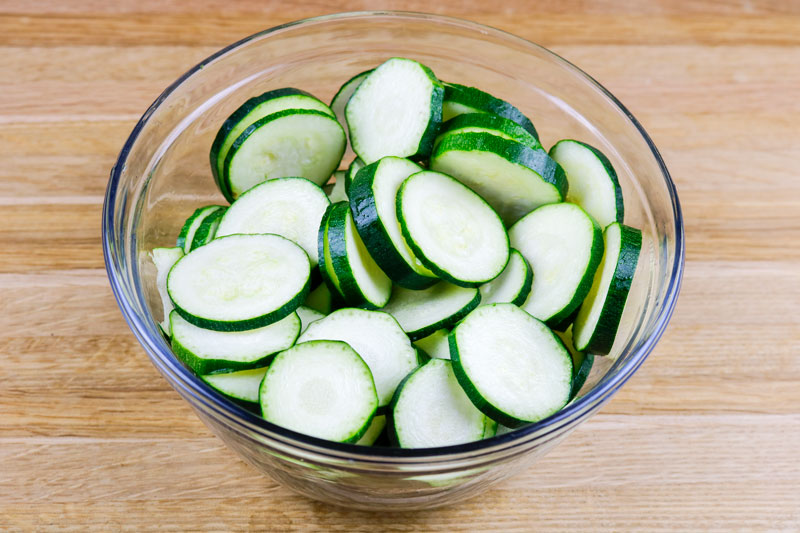 A Bowl Of Sliced Zucchini